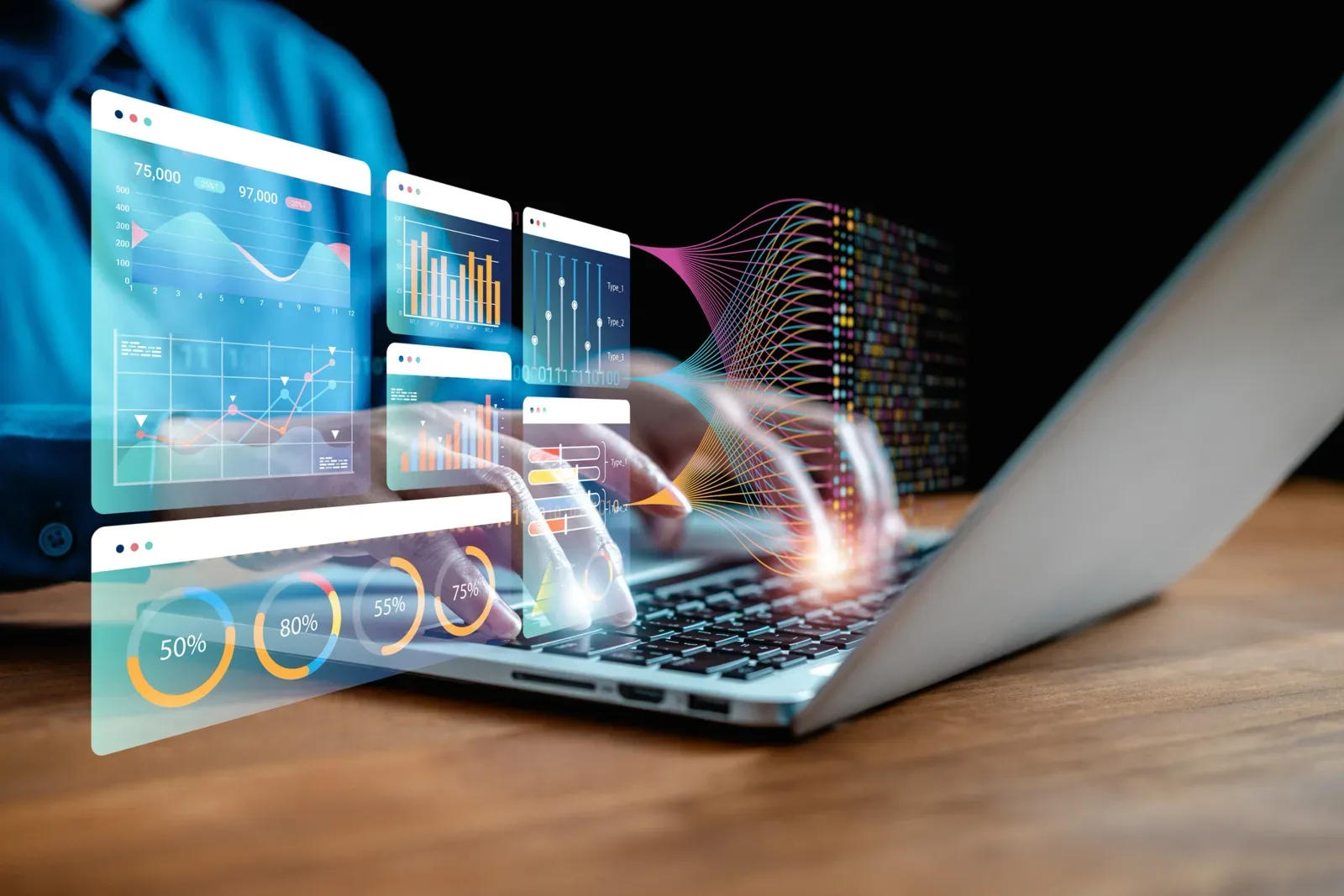 Analytics dashboards projected above a laptop keyboard