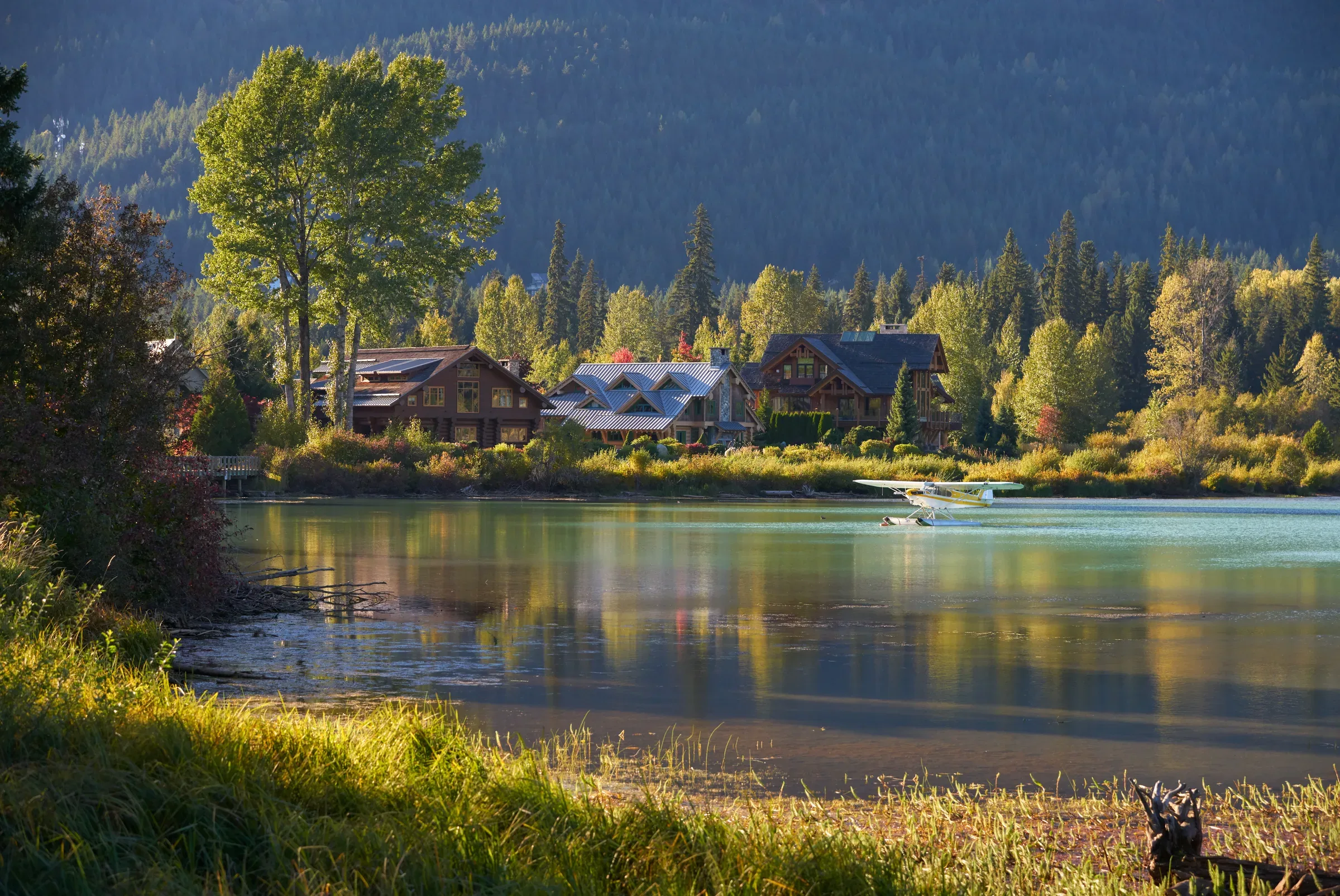 A float plane landing on Green Lake in Whistler, British Columbia